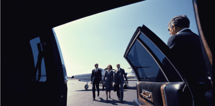 Corporate group Coming towards a Car from a jet at the Boston Logan International Airport, Massacusetts