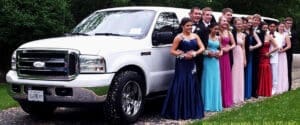 group of Youngsters in front of prom limousine by Metrowest Limousine